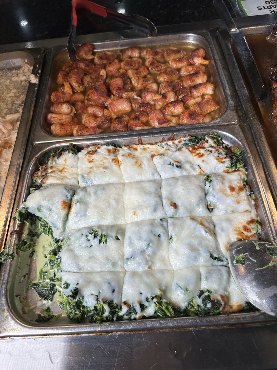 Casserole and popcorn chicken. A cheese-topped baked casserole beside popcorn chicken