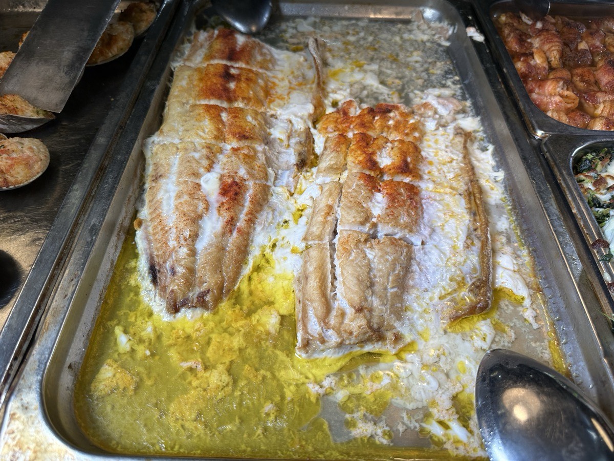 Baked white fish fillets in a buttery sauce