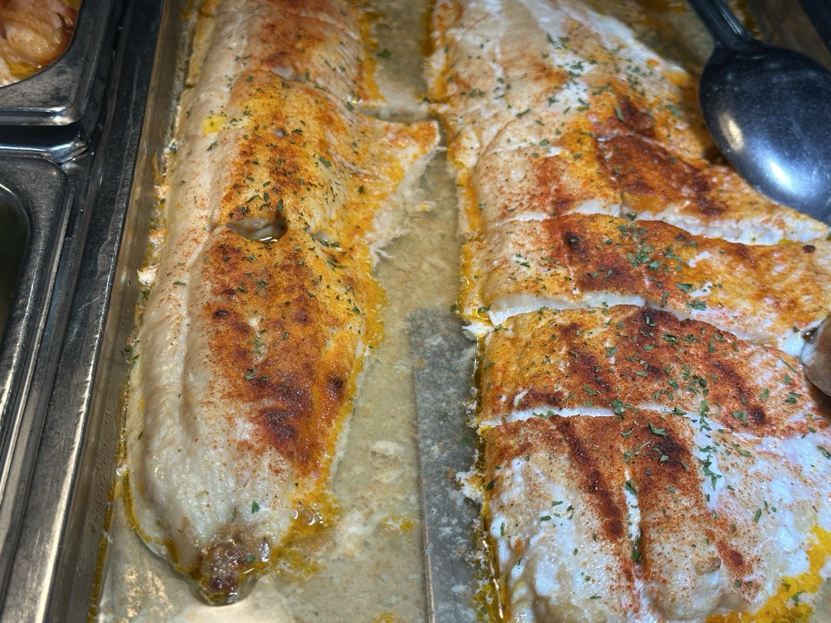 Baked salmon fillets seasoned and served in a tray