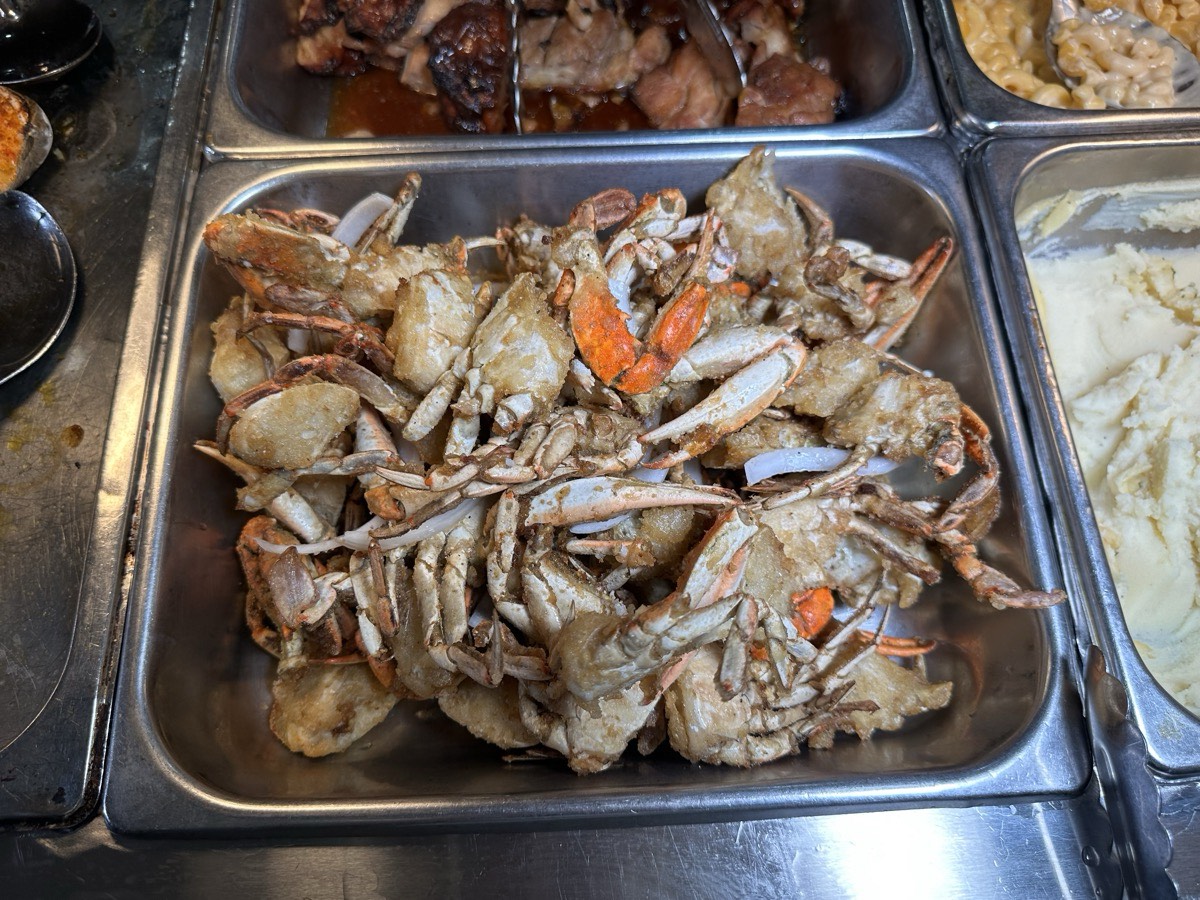 A serving tray of whole blue crab