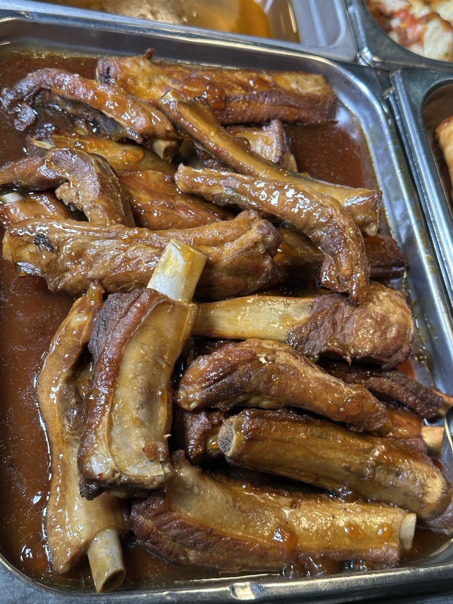 Braised spare ribs. A tray of braised spare ribs in dark sauce