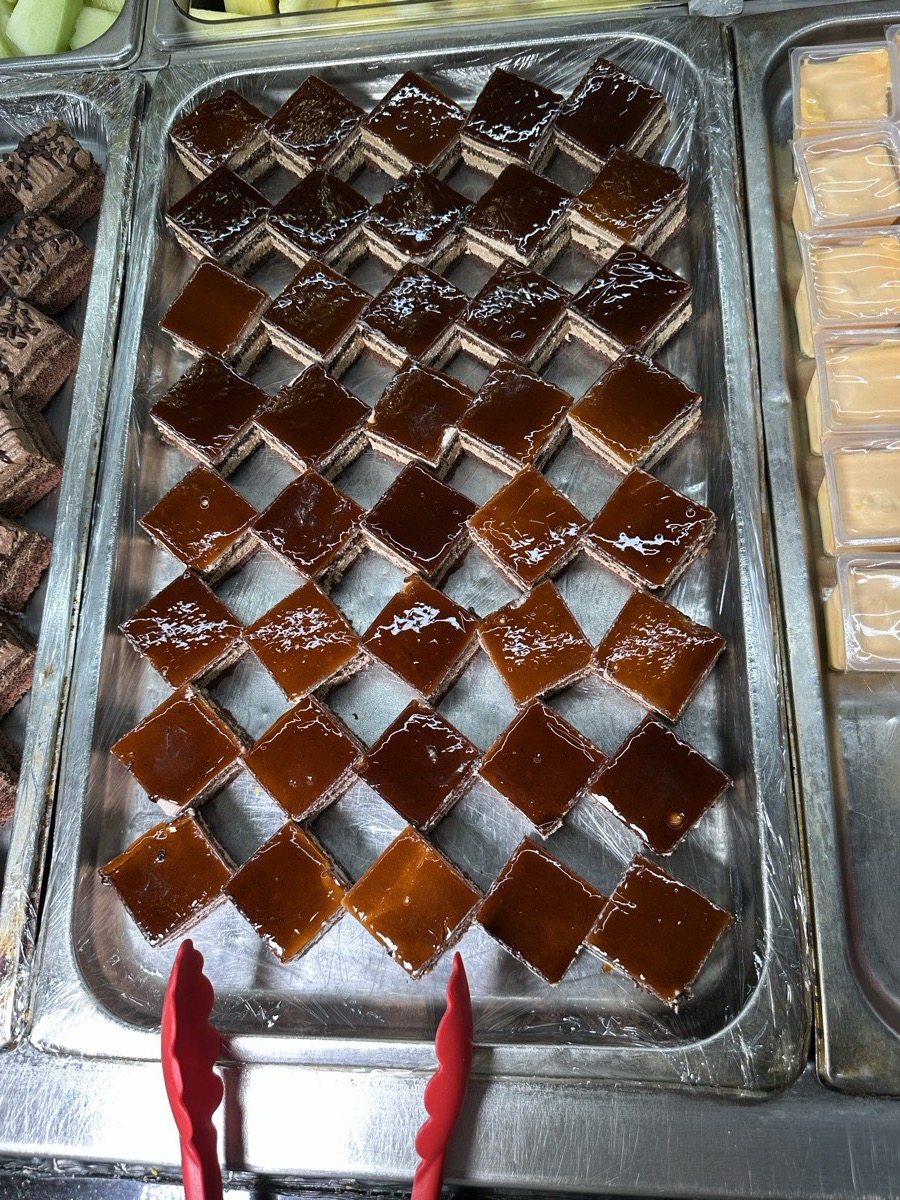 A tray of glossy amber jelly squares