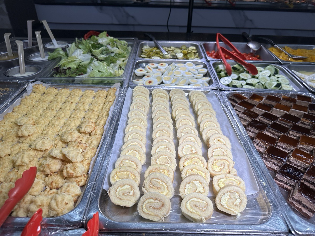 Trays of salads, pastries and desserts along the cold bar