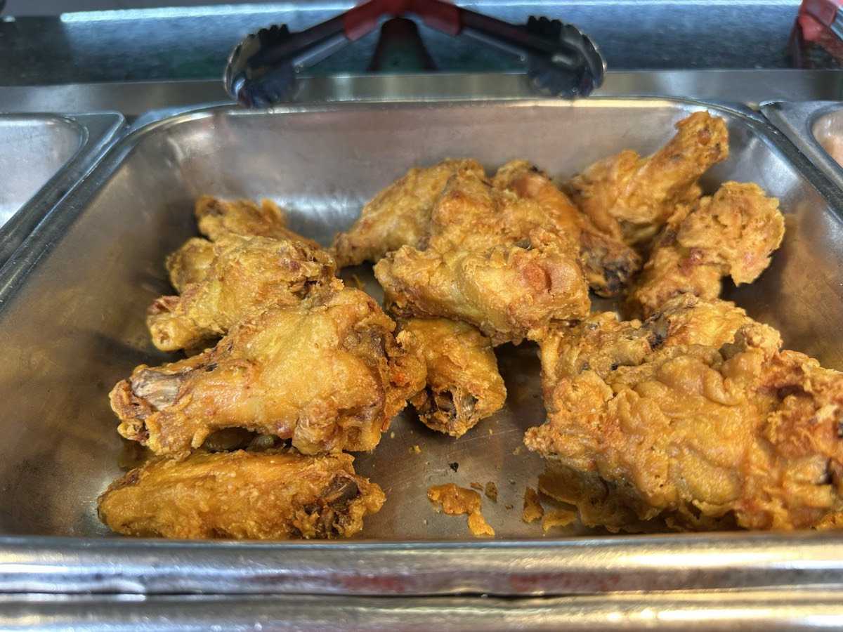 A tray of golden fried chicken wings