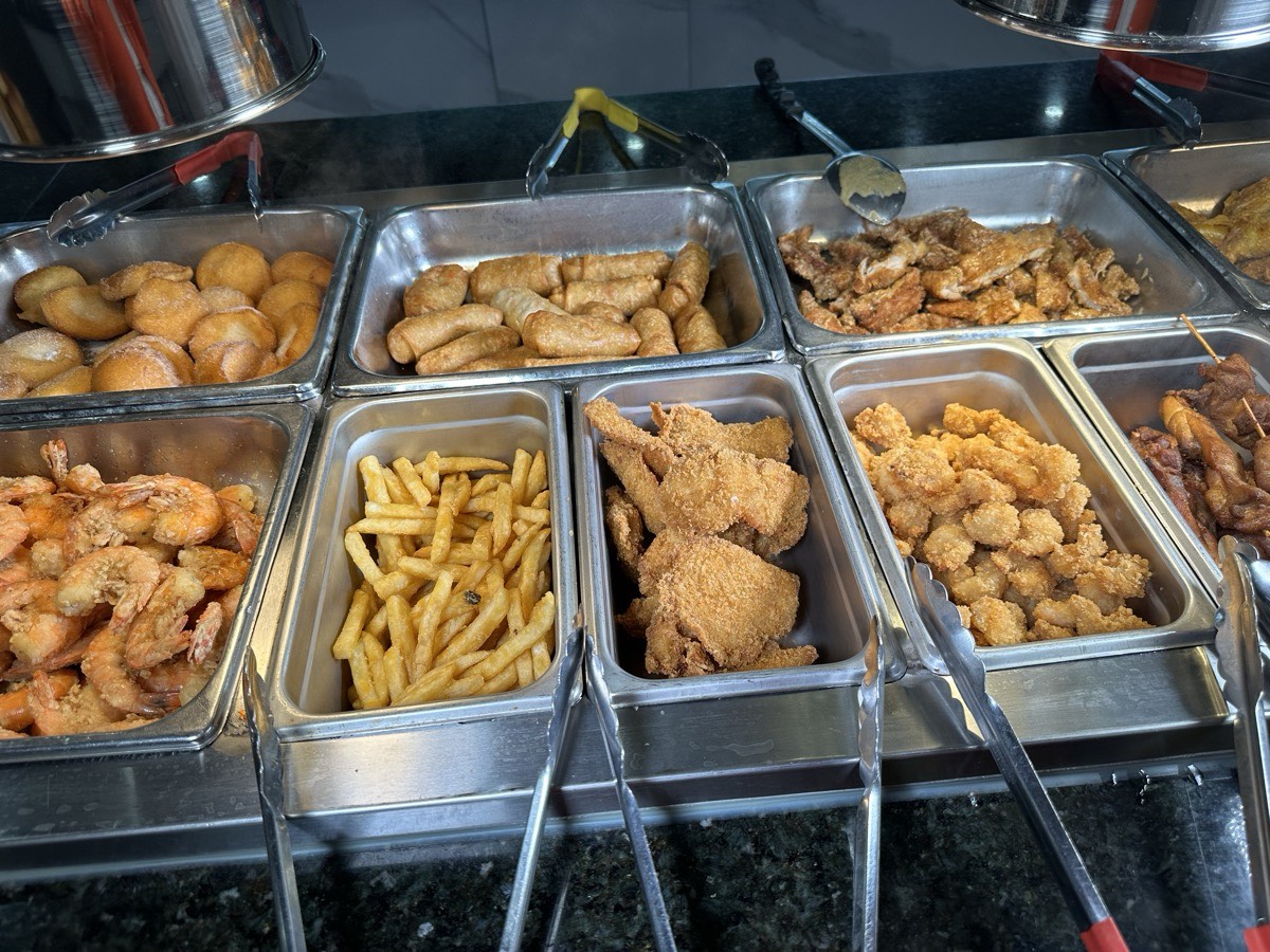 Fried favourites Bins of fried shrimp, fries and nuggets along the hot line