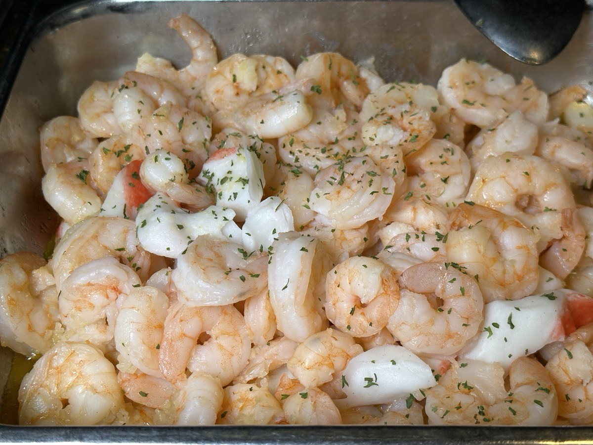 Garlic shrimp. A tray of peeled shrimp cooked with garlic and herbs