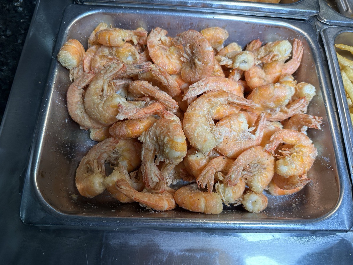 A tray of cooked shell-on shrimp
