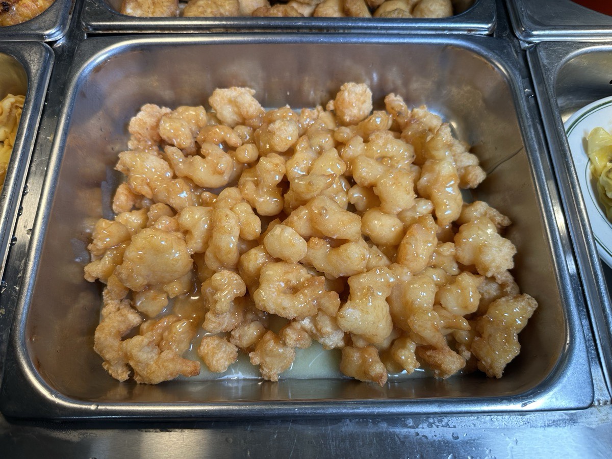 Sweet and sour chicken. A tray of battered sweet and sour chicken pieces